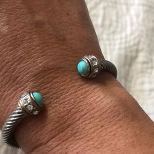 Turquoise and silver colored bracelet